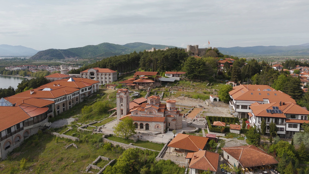 Aerial view of the Church of Saints Clement of Ohrid and Panteleimon surrounded by archaeological ruins lush green hills and historic buildings in Ohrid Municipality of Ohrid North Macedonia. Aerial view of the Church of Saints Clement of Ohrid and Panteleimon surrounded by archaeological ruins lush green hills and historic buildings in Ohrid Municipality of Ohrid North Macedonia.