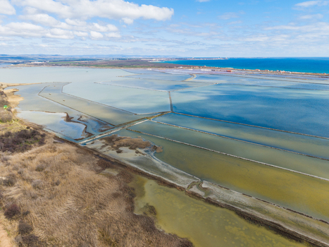 Aerial view of Lake Atanasovsko salt pans with evaporation ponds and coastal wetlands near the Black Sea in Burgas Burgas Bulgaria. Aerial view of Lake Atanasovsko salt pans with evaporation ponds and coastal wetlands near the Black Sea in Burgas Burgas Bulgaria.