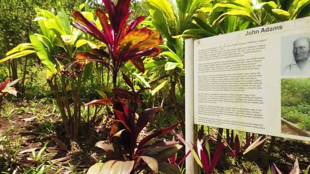 View of John Adams informational sign Pitcairn Islands.