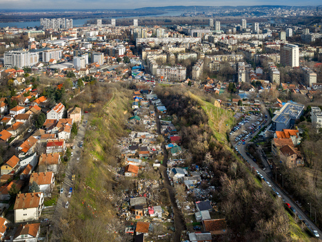 Aerial view of the urban landscape of Belgrade with residential neighborhoods a central ravine area and the city skyline in the background in Belgrade City of Belgrade Serbia. Aerial view of the urban landscape of Belgrade with residential neighborhoods a central ravine area and the city skyline in the background in Belgrade City of Belgrade Serbia.