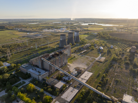 Aerial view of the abandoned Inota Power Plant cooling towers and industrial complex in Varpalota Hungary. Aerial view of the abandoned Inota Power Plant cooling towers and industrial complex in Varpalota Hungary.