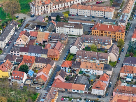 Aerial view of the star shaped fortress city with its symmetrical layout and red tiled roofs contrasting against the lush greenery Neuf Brisach Grand Est France.