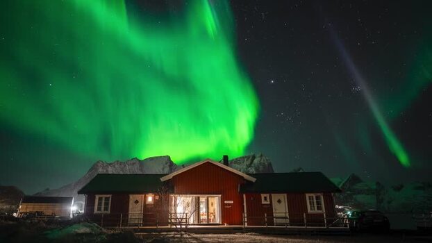 View of Lofoten cabin under the Northern Lights Norway. View of Lofoten cabin under the Northern Lights Norway.