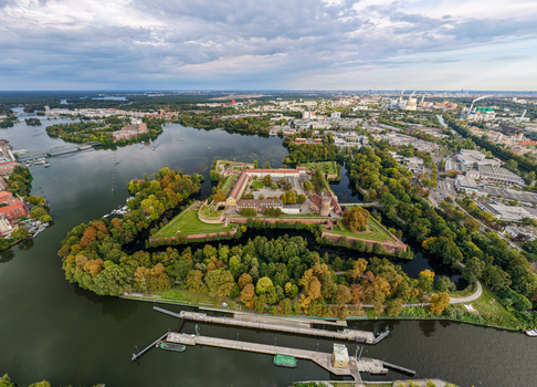Aerial view of Spandau Citadel surrounded by lush trees historic fortifications and the Havel river in Berlin Berlin Germany.