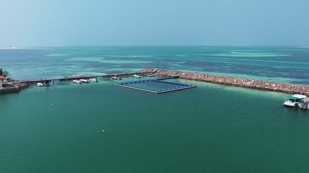 Aerial view of a jetty and floating pool in Makunudhoo Maldives. Aerial view of a jetty and floating pool in Makunudhoo Maldives.