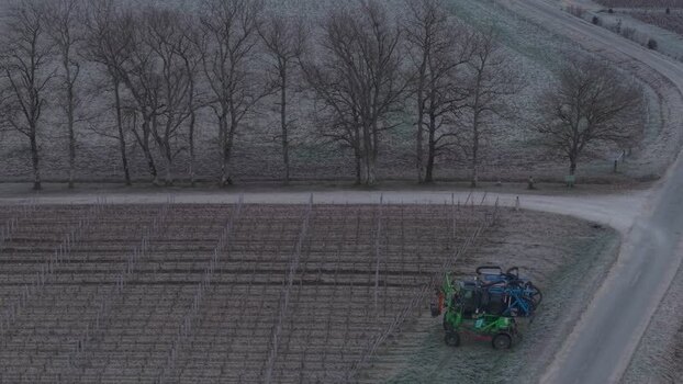 Aerial view of a tractor in vineyard France.