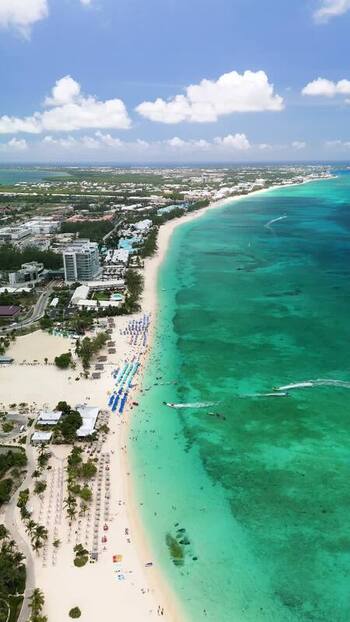 Aerial view of Seven Mile Beach and resorts in Cayman Islands. Aerial view of Seven Mile Beach and resorts in Cayman Islands.