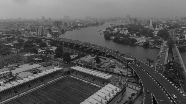 Aerial view of Lagos Island featuring the stadium bridge and urban landscape in Lagos Lagos Nigeria. Aerial view of Lagos Island featuring the stadium bridge and urban landscape in Lagos Lagos Nigeria.