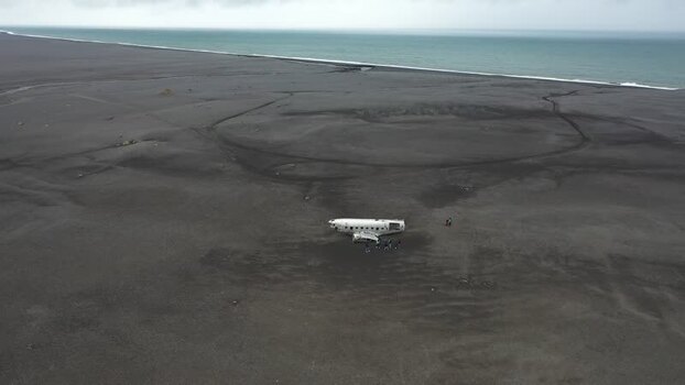 Aerial view of Solheimasandur plane wreck on black sand Iceland.