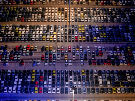 Aerial view of new cars parked at a distribution centre in Rivalta di Torino Piedmont Italy.
