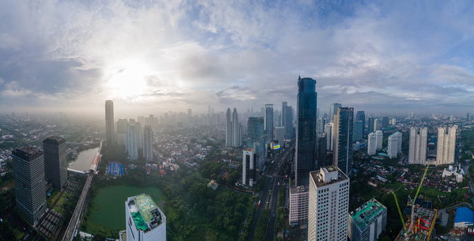 South Jakarta Indonesia 10 January 2026 Aerial view of the modern skyline with skyscrapers dense urban housing and lush greenery under a hazy morning sky. South Jakarta Indonesia 10 January 2026 Aerial view of the modern skyline with skyscrapers dense urban housing and lush greenery under a hazy morning sky.