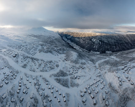 Aerial view of Gaustablikk Fjellresort with snow covered cabins and mountains in Rjukan Telemark Norway. Aerial view of Gaustablikk Fjellresort with snow covered cabins and mountains in Rjukan Telemark Norway.