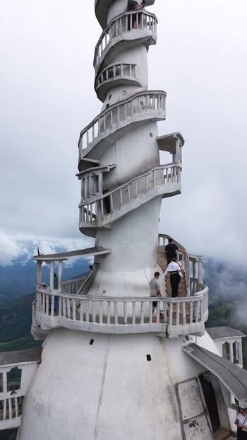 Aerial view of Ambuluwawa Tower with tourists in Gampola Sri Lanka.