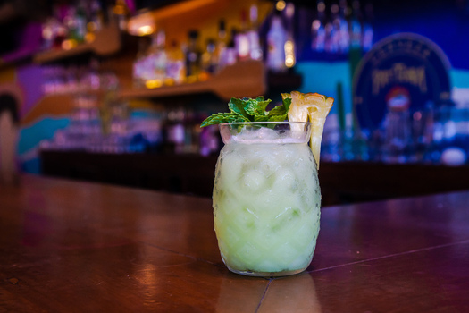 View of a cocktail in a pineapple shaped glass garnished with mint and pineapple at Ruba s Bakery Bistro San Jose del Cabo Baja California Sur Mexico.