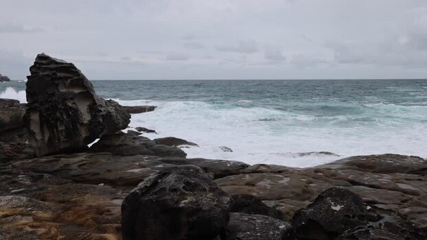 View of the rocky coastline at Bondi Beach Australia.