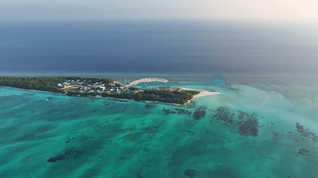 Aerial view of Fulhadhoo island and coral reefs Maldives. Aerial view of Fulhadhoo island and coral reefs Maldives.