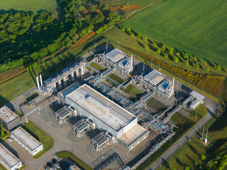 Aerial view of the UGS Damborice gas storage facility with industrial structures and pipelines surrounded by green fields in Damborice South Moravian Region Czechia. Aerial view of the UGS Damborice gas storage facility with industrial structures and pipelines surrounded by green fields in Damborice South Moravian Region Czechia.