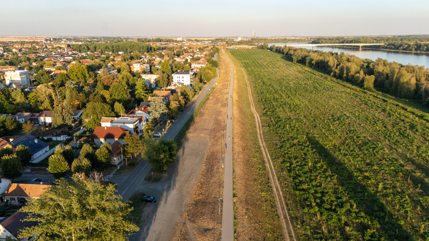 Aerial view of Sremska Mitrovica showing the residential area a long pedestrian path along the riverbank and the Sava river with a bridge Sremska Mitrovica Vojvodina Serbia. Aerial view of Sremska Mitrovica showing the residential area a long pedestrian path along the riverbank and the Sava river with a bridge Sremska Mitrovica Vojvodina Serbia.