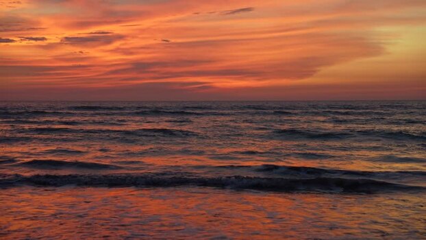 View of the sunset over the waves at Cox s Bazar Bangladesh. View of the sunset over the waves at Cox s Bazar Bangladesh.