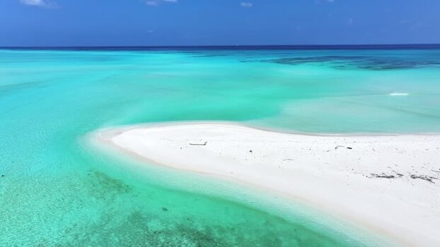 Aerial view of a white sandbank and turquoise water in Maldives. Aerial view of a white sandbank and turquoise water in Maldives.