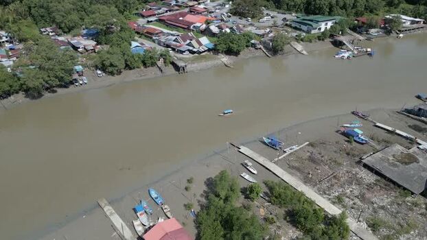 Aerial view of river with boats in Sarawak Malaysia. Aerial view of river with boats in Sarawak Malaysia.