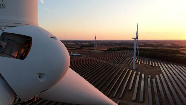 Aerial view of wind turbine and solar farm in United Kingdom. Aerial view of wind turbine and solar farm in United Kingdom.