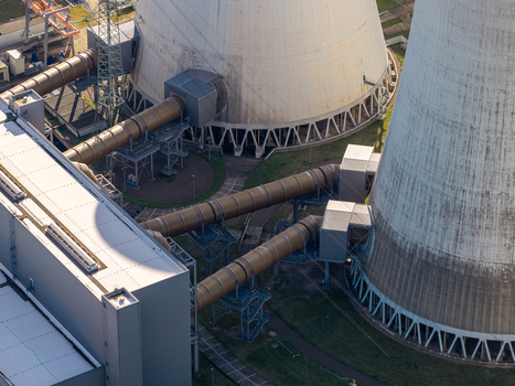 Aerial view of the Janschwalde Power Station featuring large cooling towers and industrial piping infrastructure in Peitz Brandenburg Germany. Aerial view of the Janschwalde Power Station featuring large cooling towers and industrial piping infrastructure in Peitz Brandenburg Germany.