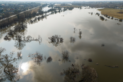 Aerial view of flooded river valley with submerged trees and sky reflections on the water surface near the town Kedainiai Kaunas County Lithuania. Aerial view of flooded river valley with submerged trees and sky reflections on the water surface near the town Kedainiai Kaunas County Lithuania.