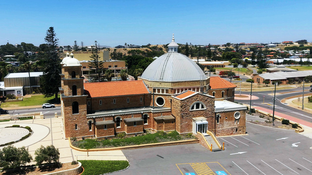 Aerial view of St Francis Xavier s Cathedral with its distinctive dome and orange tiled roof surrounded by urban landscape in Geraldton Western Australia Australia. Aerial view of St Francis Xavier s Cathedral with its distinctive dome and orange tiled roof surrounded by urban landscape in Geraldton Western Australia Australia.