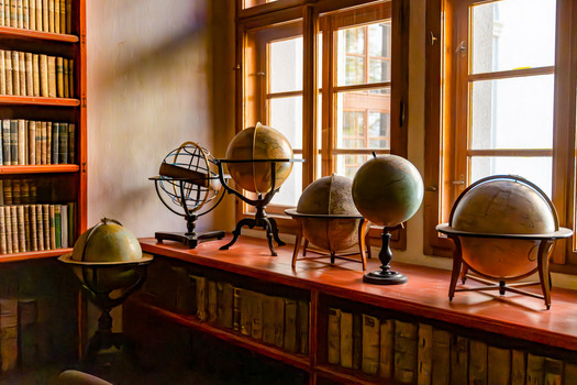 Hlavni mesto Praha Czechia 08 May 2023 View of the Philosophical Hall in the Strahov Library featuring antique globes and shelves filled with old books illuminated by natural light. Hlavni mesto Praha Czechia 08 May 2023 View of the Philosophical Hall in the Strahov Library featuring antique globes and shelves filled with old books illuminated by natural light.