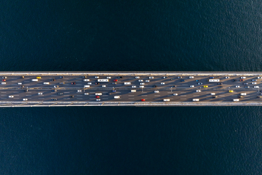 Aerial view of Fatih Sultan Mehmet Bridge with heavy traffic flowing across the suspension bridge over the Bosphorus strait in Beykoz Istanbul Turkiye. Aerial view of Fatih Sultan Mehmet Bridge with heavy traffic flowing across the suspension bridge over the Bosphorus strait in Beykoz Istanbul Turkiye.