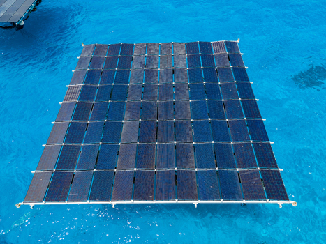 Aerial view of the SolarSea floating solar power plant by Swimsol on clear turquoise water in Dharavandhoo Baa Atoll Maldives. Aerial view of the SolarSea floating solar power plant by Swimsol on clear turquoise water in Dharavandhoo Baa Atoll Maldives.