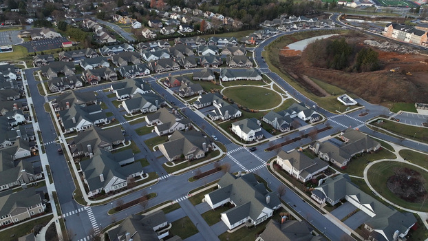 Aerial view of a suburban residential neighborhood with houses paved streets and green spaces in Lititz Pennsylvania United States. Aerial view of a suburban residential neighborhood with houses paved streets and green spaces in Lititz Pennsylvania United States.