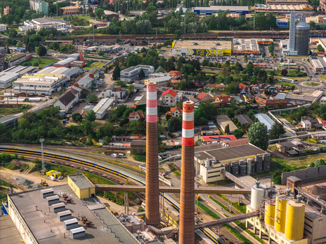 Aerial view of Tepelna elektrarna Hodonin with its tall red and white striped chimneys and industrial facilities Hodonin Jihomoravsky kraj Czechia. Aerial view of Tepelna elektrarna Hodonin with its tall red and white striped chimneys and industrial facilities Hodonin Jihomoravsky kraj Czechia.