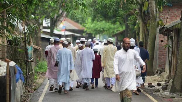 View of men in traditional attire on a village road Bangladesh. View of men in traditional attire on a village road Bangladesh.