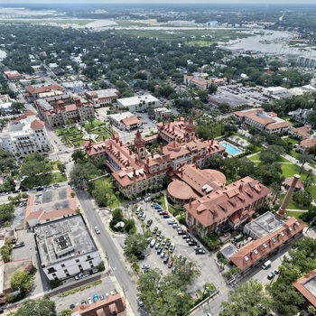 Aerial view of Flagler College with its distinctive Spanish Renaissance Revival architecture red tiled roofs and lush courtyards in St. Augustine Florida United States. Aerial view of Flagler College with its distinctive Spanish Renaissance Revival architecture red tiled roofs and lush courtyards in St. Augustine Florida United States.