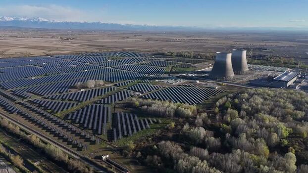 Aerial view of solar park and towers Italy.