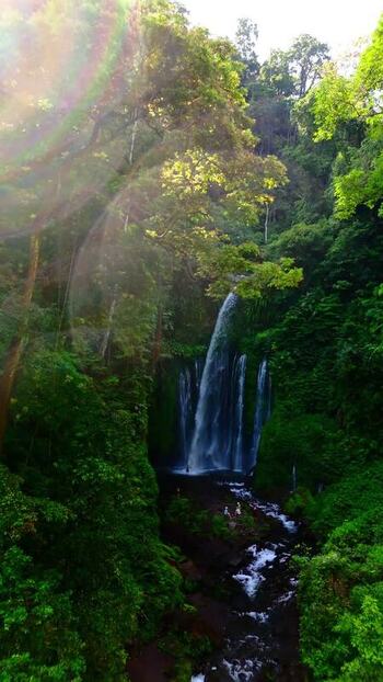 Aerial view of Tiu Kelep Waterfall in the forest Indonesia.