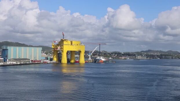 Aerial view of a large yellow offshore platform Norway.