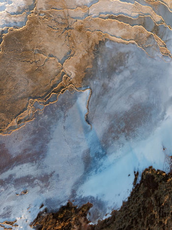 Aerial view of the Reykjanes peninsula featuring geothermal mineral rich blue water and rugged volcanic terrain in Grindavikurbaer Iceland. Aerial view of the Reykjanes peninsula featuring geothermal mineral rich blue water and rugged volcanic terrain in Grindavikurbaer Iceland.