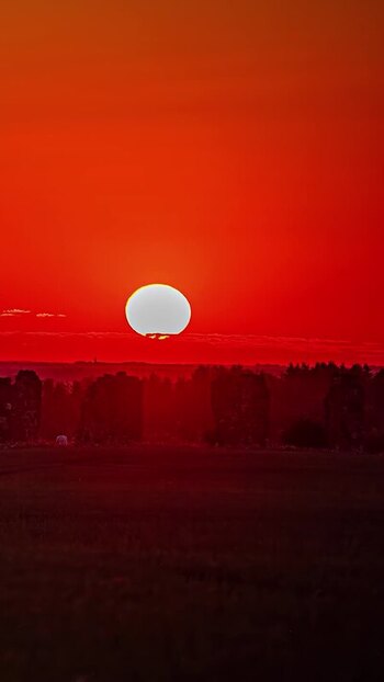 View of vibrant sunset over rural landscape in Latvia. View of vibrant sunset over rural landscape in Latvia.