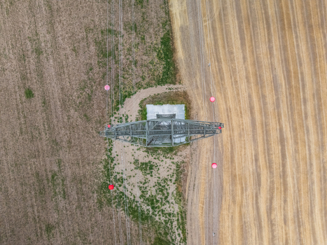 Aerial view of power lines crossing summer farmland near Ercsi Hungary Aerial view of power lines crossing summer farmland near Ercsi Hungary