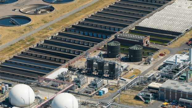 Aerial view of Severn Trent Water Minworth treatment plant with large sedimentation tanks long filtration channels and industrial silos in Birmingham England United Kingdom. Aerial view of Severn Trent Water Minworth treatment plant with large sedimentation tanks long filtration channels and industrial silos in Birmingham England United Kingdom.
