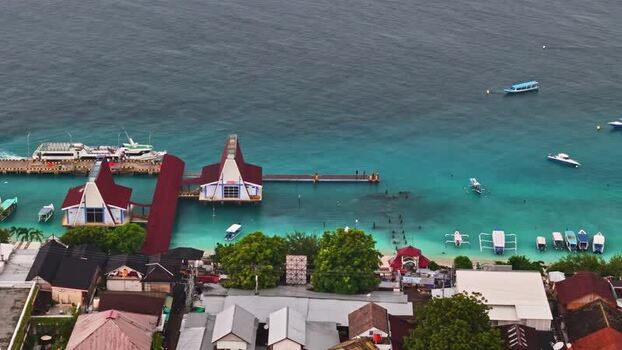 Aerial view of coastal pier and boats in Bali Indonesia.