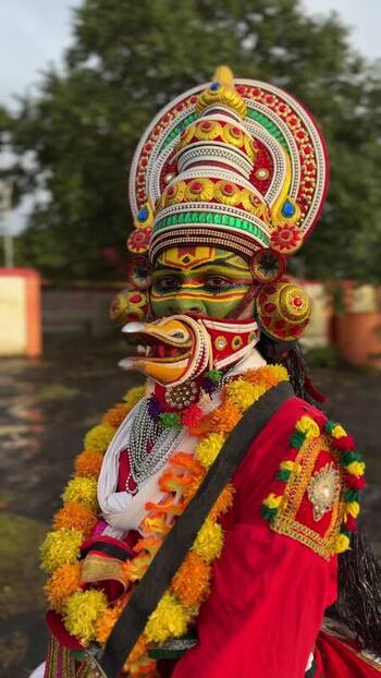 View of a Kathakali performer in traditional costume and makeup in Kochi India. View of a Kathakali performer in traditional costume and makeup in Kochi India.