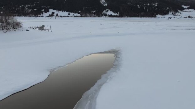 Aerial view of frozen Lake Reschen in Graun im Vinschgau Italy. Aerial view of frozen Lake Reschen in Graun im Vinschgau Italy.