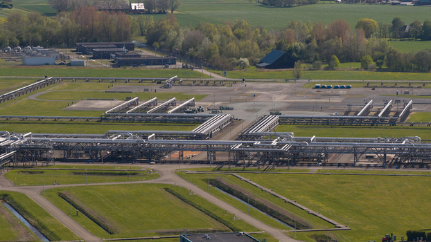 Aerial view of NAM Grijpskerk UGS facility with industrial pipelines storage infrastructure and surrounding green fields Grijpskerk Groningen Netherlands.