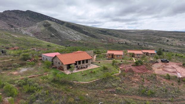 Torotoro Bolivia 29 September 2026 Aerial view of Torotoro Hostal Restaurante in the rugged mountainous landscape of Potosi Department featuring stone buildings with terracotta roofs.