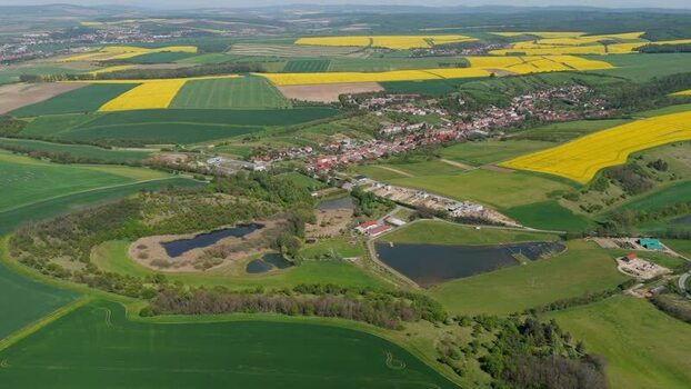 Aerial view of a village and yellow fields in Brno Czechia.