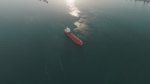 Aerial view of a red cargo ship near Augusta Italy. Aerial view of a red cargo ship near Augusta Italy.